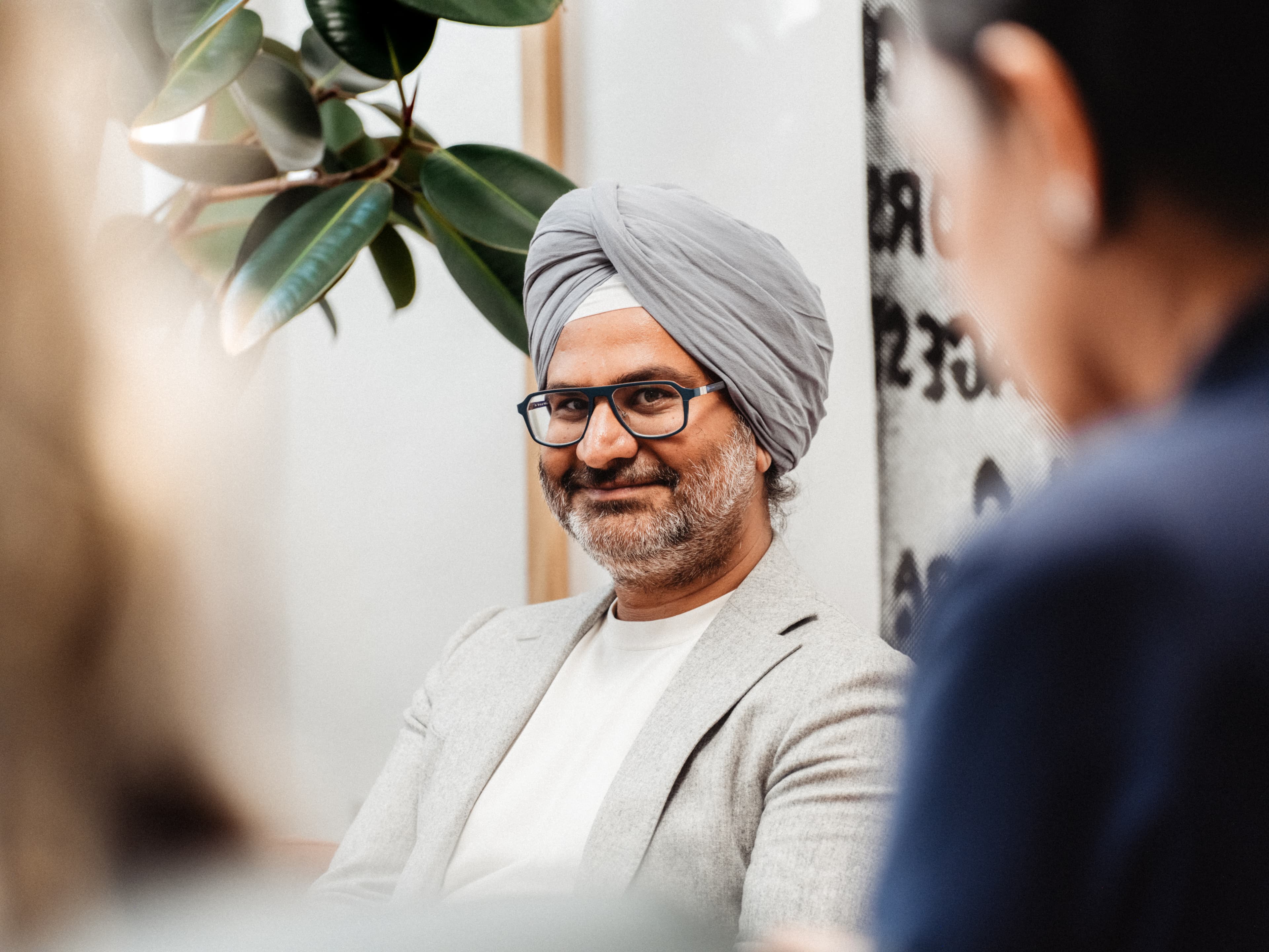 Man smiling in a meeting
